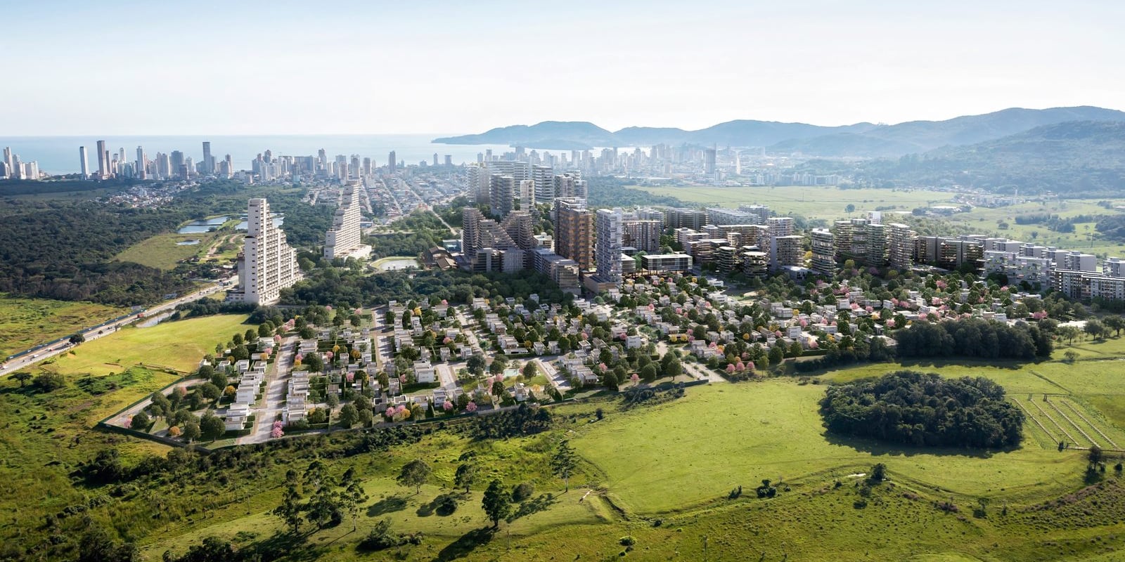Render aéreo do VivaPark Porto Belo, bairro-parque planejado, com o litoral e o skyline ao fundo